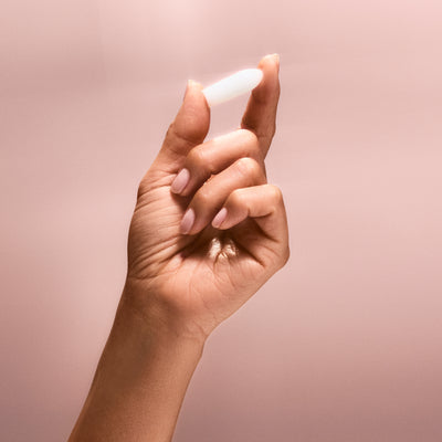 Hand holding a suppository